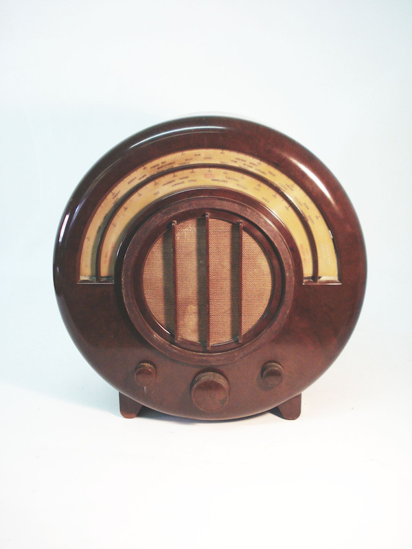 Figure 4 — An Ekco Type AD65 (1934), the round brown Bakelite radio designed by Wells Coates — an Art Deco design icon of exactly the sort that turns up when hunting 1930s British radio and television materia…